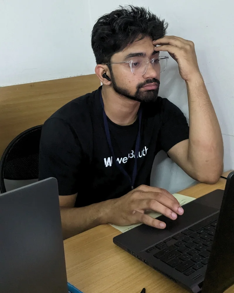 Aalishan working at his laptop